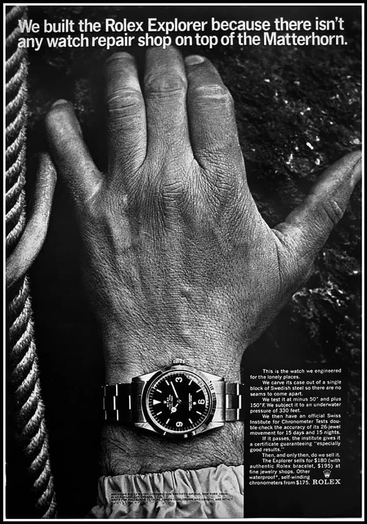 Black-and-white Rolex Explorer advertisement showing a watch on a climber's wrist