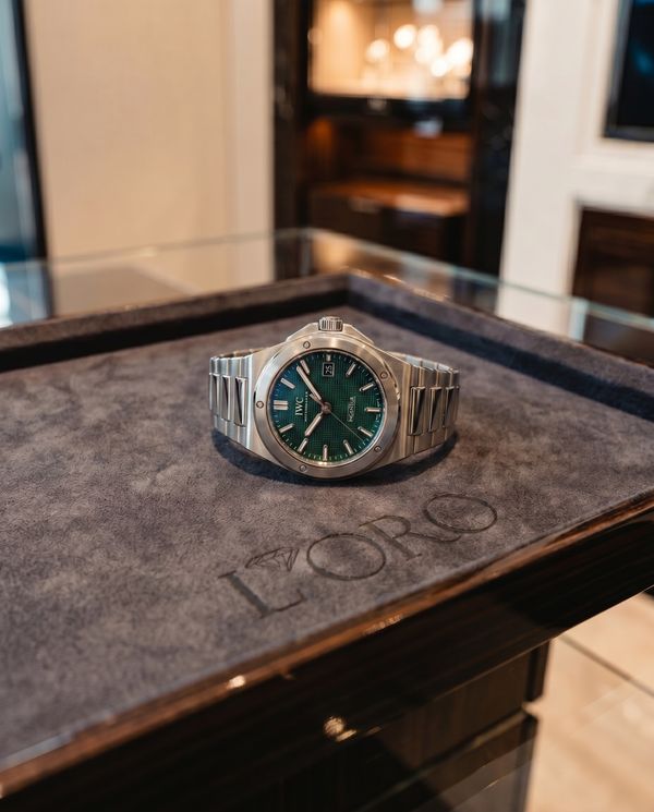IWC Ingenieur with green textured dial on a boutique display tray