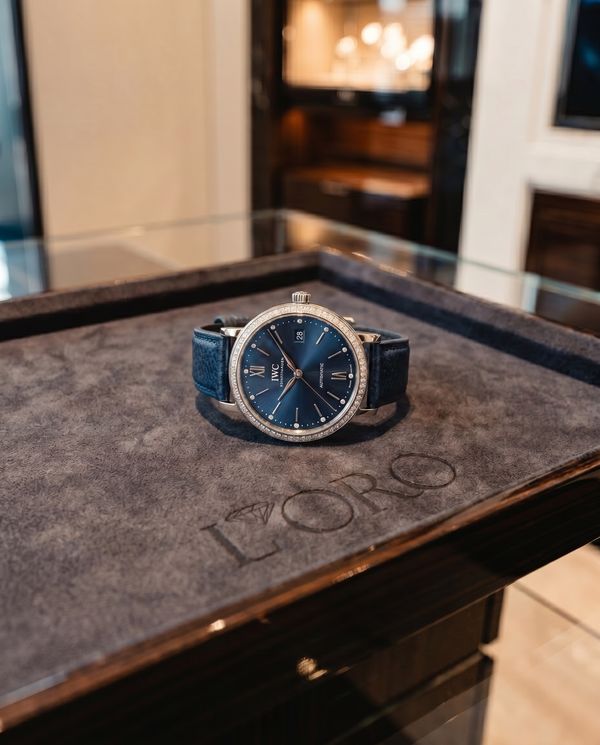 IWC Portofino with blue dial and diamond bezel on a leather strap