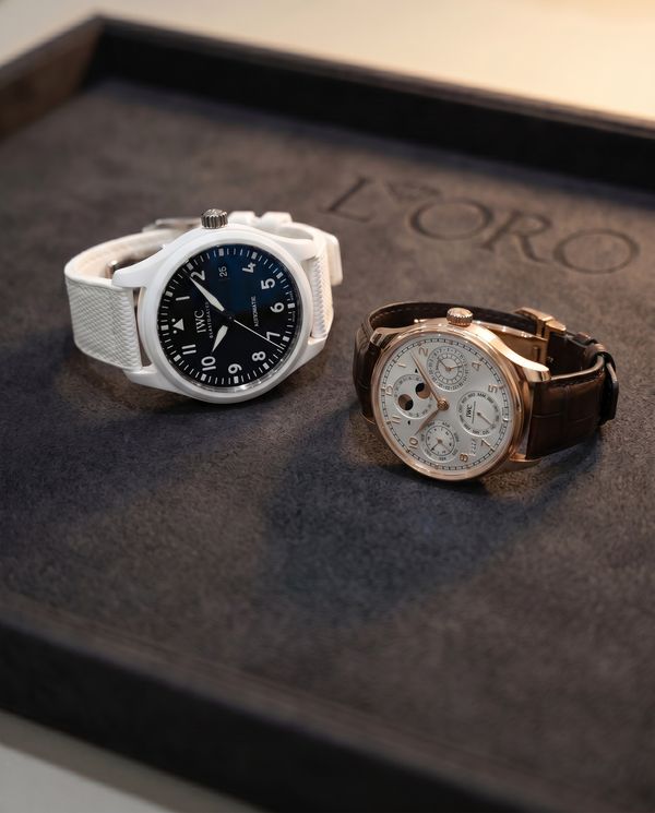 IWC Pilot in white ceramic beside an IWC Portugieser perpetual calendar in rose gold
